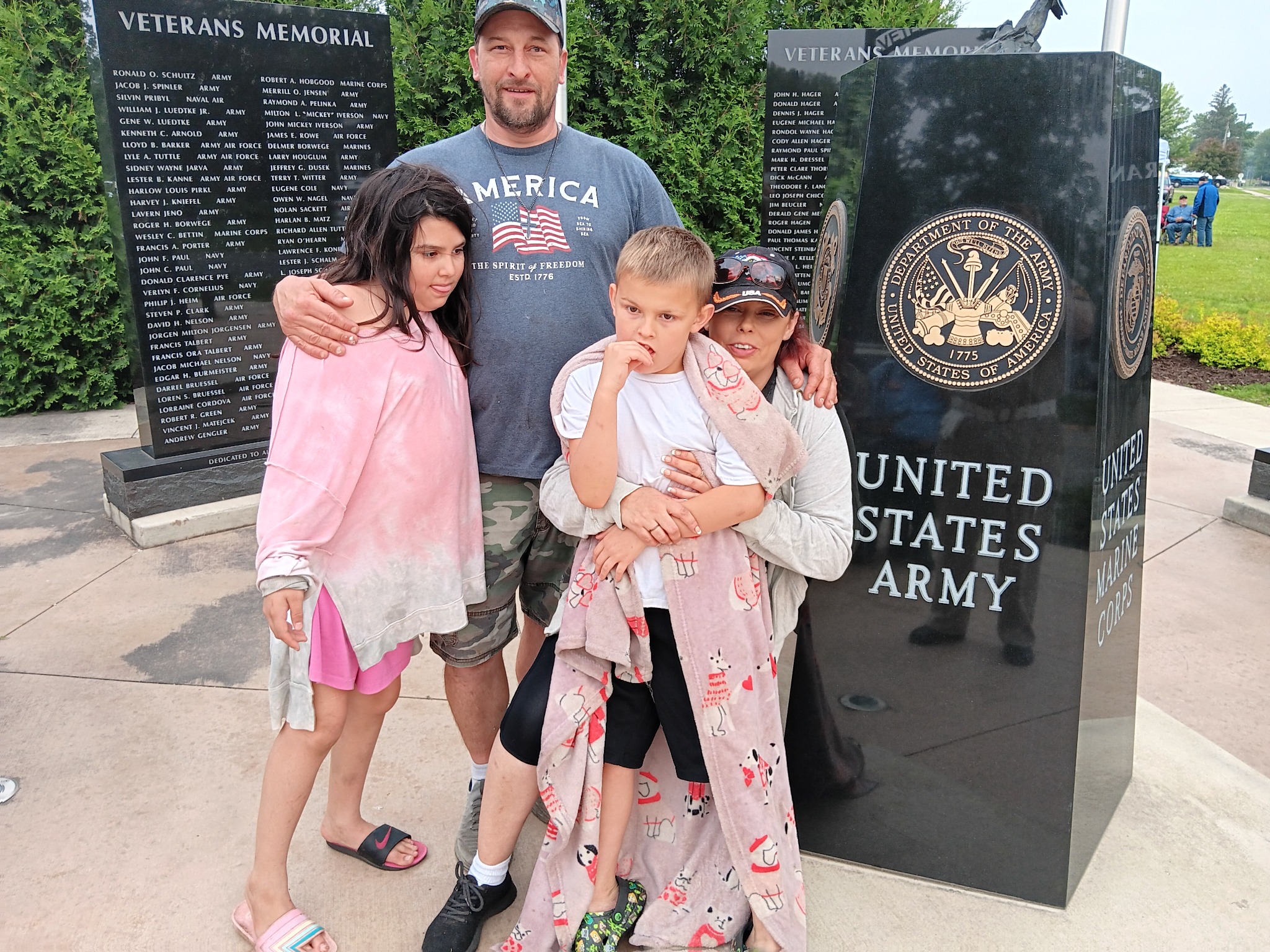 The Stanley family together at a veterans memorial